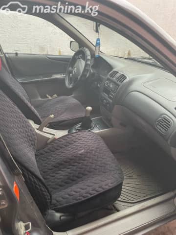 Mazda 323 VI (BJ) Рестайлинг 1.6 MT