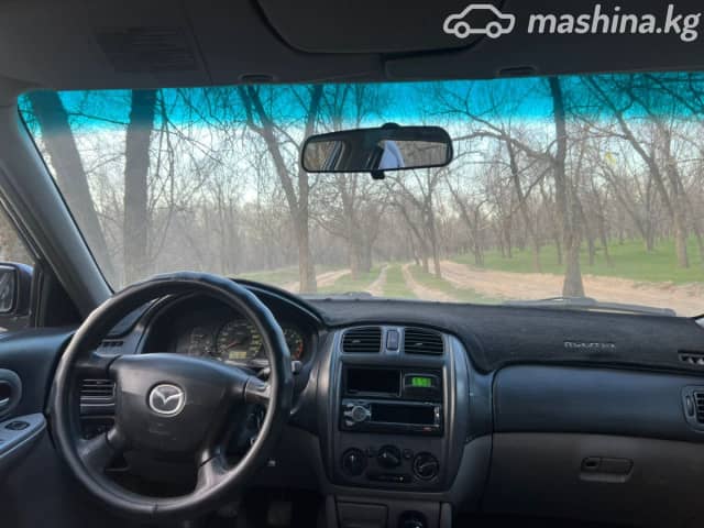 Mazda 323 VI (BJ) Рестайлинг 1.6 MT