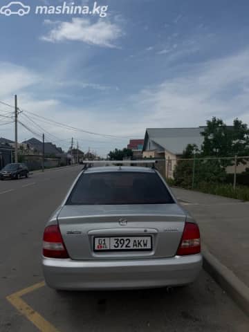 Mazda 323 VI (BJ) Рестайлинг 1.6 MT