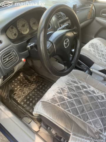 Mazda 323 VI (BJ) Рестайлинг 1.6 MT