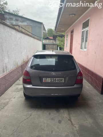 Mazda 323 VI (BJ) Рестайлинг 1.6 MT
