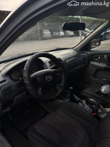 Mazda 323 VI (BJ) Рестайлинг 1.6 MT