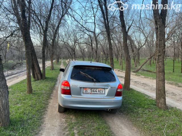 Mazda 323 VI (BJ) Рестайлинг 1.6 MT