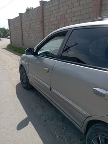Kia Carens I (RS) Рестайлинг 1.8 MT