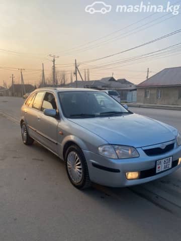Mazda 323 VI (BJ) Рестайлинг 1.6 MT