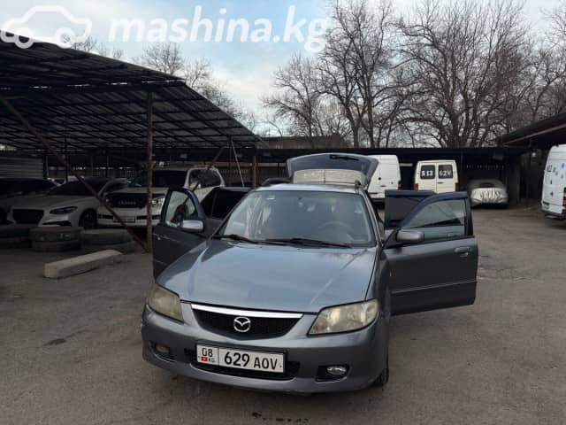 Mazda 323 VI (BJ) Рестайлинг 1.6 MT