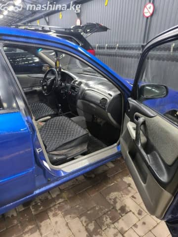 Mazda 323 VI (BJ) Рестайлинг 1.6 MT