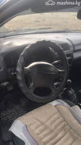 Mazda 323 V (BA) 1.5 MT