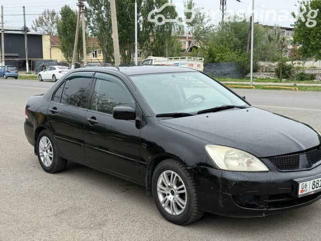Mitsubishi Lancer IX Рестайлинг 1.6 AT