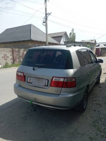 Kia Carens I (RS) Рестайлинг 1.8 MT