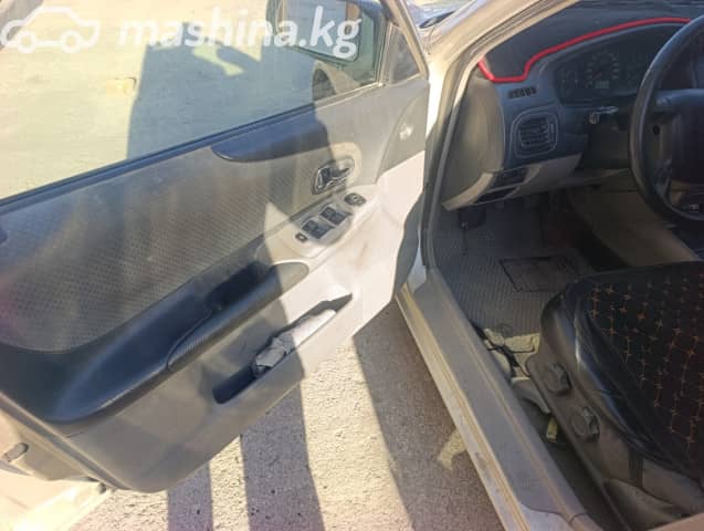 Mazda 323 VI (BJ) Рестайлинг 1.5 MT