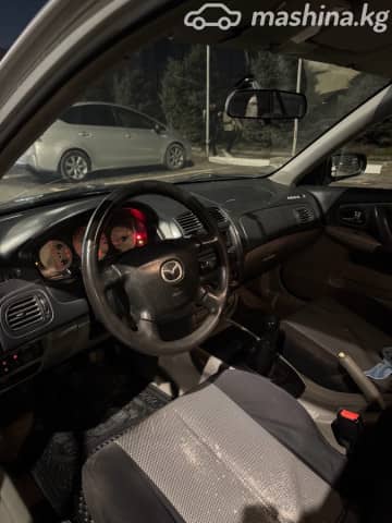 Mazda 323 VI (BJ) Рестайлинг 1.6 MT