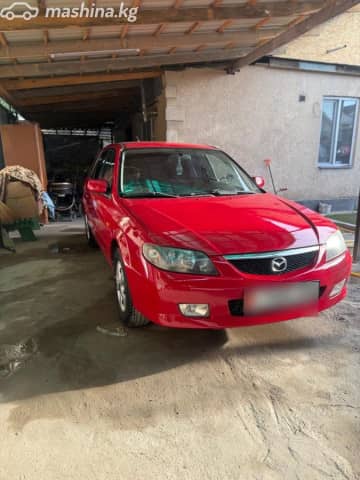 Mazda 323 VI (BJ) Рестайлинг 1.6 MT