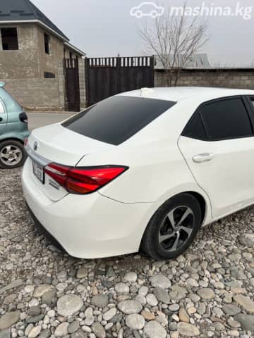Toyota Corolla XI (E160, E170, E180) Рестайлинг 1 Axio 1.5hyb CVT